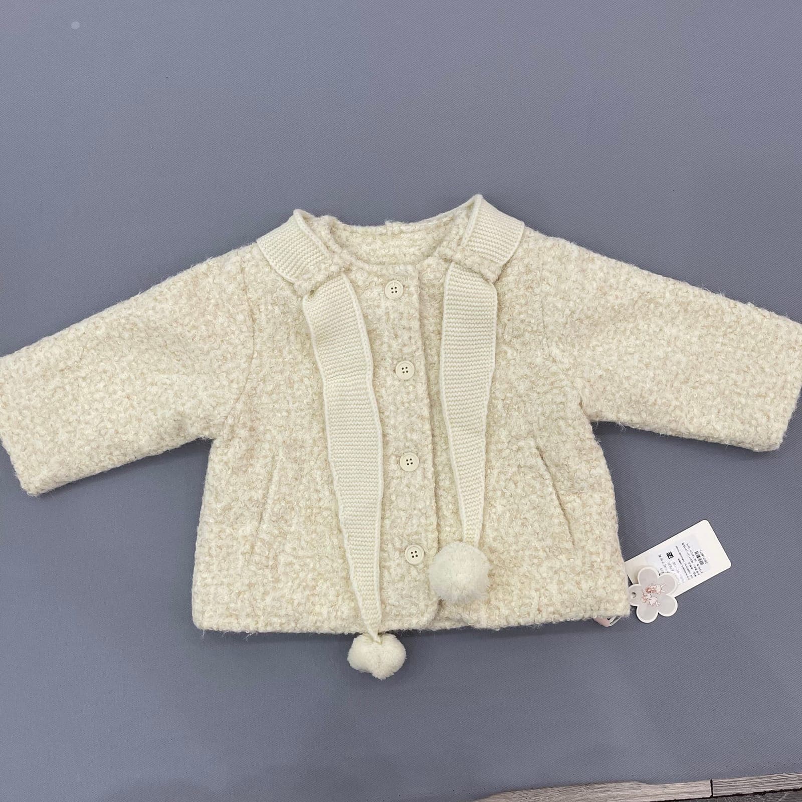 Áo khoác lông cừu cổ sen phối dây pom-pom